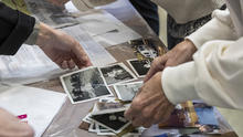 Hands caring for photos 