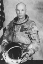 black and white astronaut Story Musgrave in flight suit
