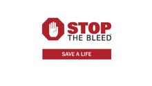 Stop the Bleed logo featuring a red stop-sign hand symbol next to the words “STOP THE BLEED” in red and black text above a red banner reading “SAVE A LIFE.”
