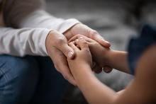 Getty Image of Adult and Child Holding Hands
