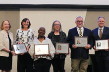 2024 Inductees pictured left to right: Sheldon Shafer (represented by two of his former coworkers), Betty Winston Bayé, Deborah Taylor Givens, Paul Prather and Peter Baniak. Not pictured: Elizabeth “Scoobie” Ryan, Kyle Vance.