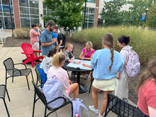 Honors students planning pollinator garden