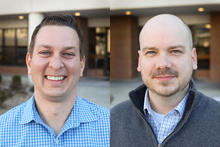 Side-by-side headshots show two men smiling outdoors in front of a building entrance. One wears a blue checkered shirt, while the other wears a gray zip-up sweater over a collared shirt.