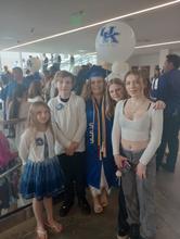 Alexandrea Shouse walked across the stage Dec. 20 surrounded by her kids. Photo provided. 