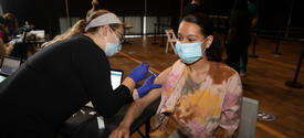 This is a photo of a Student receiving a COVID-19 vaccination at the Blue Box Theater on April 8, 2021.