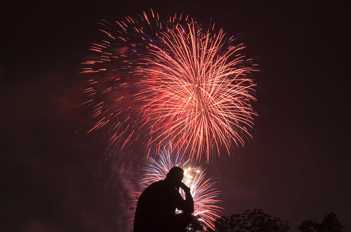 A person watching fireworks. 