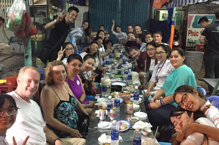 photo of Exec MBA group gathers for an evening meal during trip
