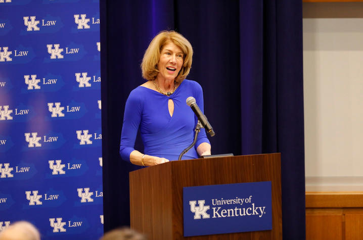 Dr. Martha Heyburn standing at podium at 2017 event