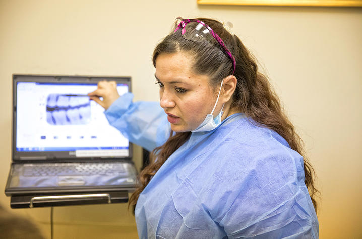 Jenny Alas reviews a care plan with a patient.