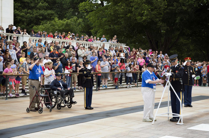 A photo of UK Honor Flight veterans at a wreath laying ceremony 