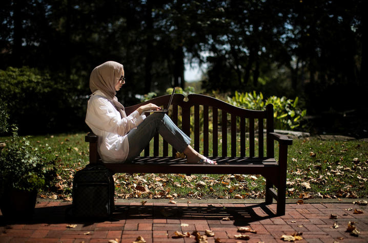 Photo of Student on a Bench