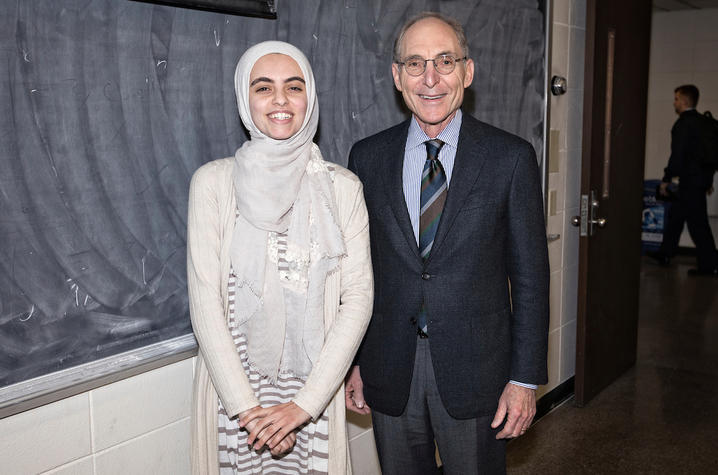 photo of Hadeel Abdallah and Capilouto in front of chalkboard