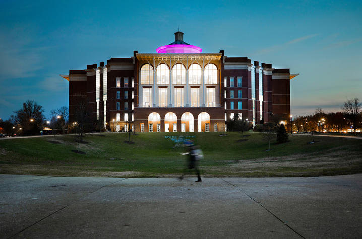 Purple light on William T. Young Library. 