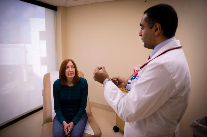 Dr. Moamen Gabr explains the procedure to patient Jackie Denault