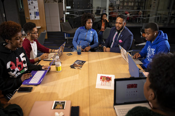 photo of group at MLK Center table with Jason Brooks