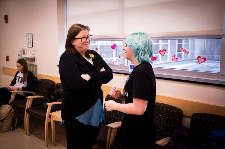 photo of Dr. Caryn Sorge with a patient in the clinic