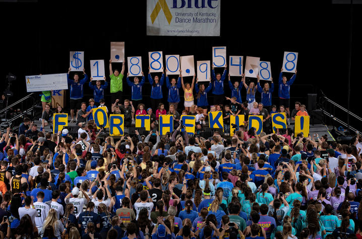 DanceBlue participants holding up total amount of money raised