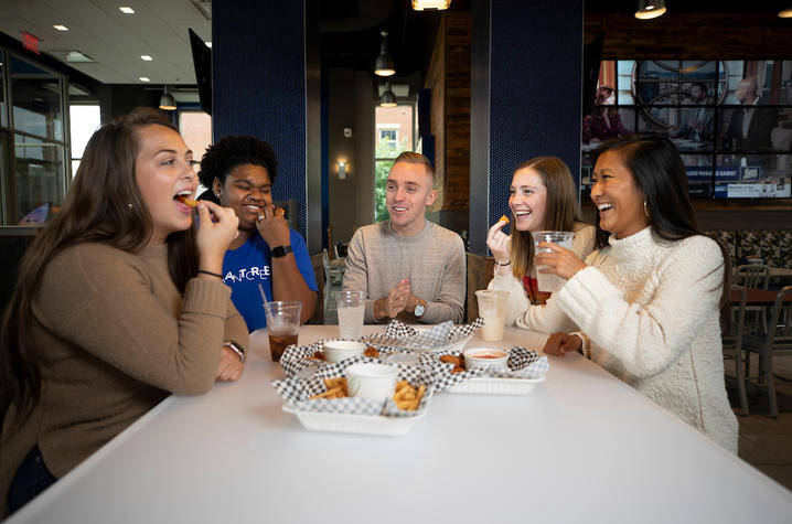 Photo of students eating together