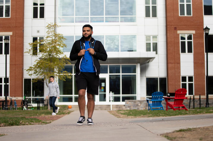 Photo of student walking on campus