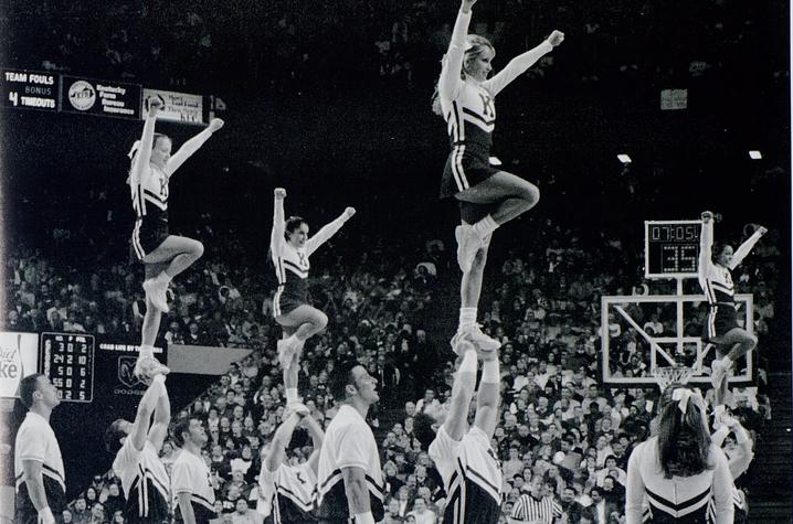 black and white photo of UK Cheerleading during game at Rupp from 2002 Kentuckian