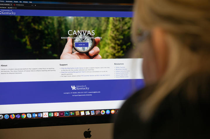 student taking online courses looking at the Canvas web page on their home computer