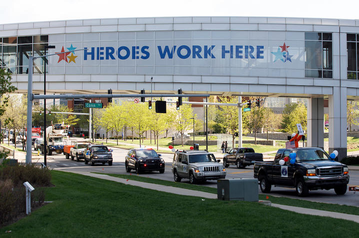 Large banner that says “Heroes Work Here”