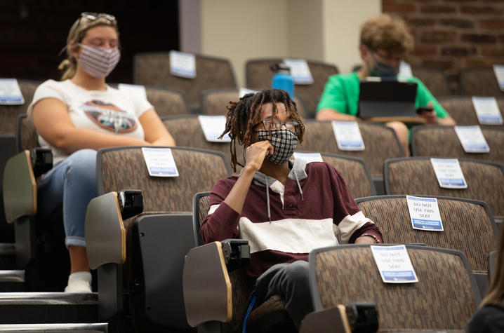 Photo of student sitting in classroom