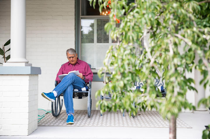 Tom Williams, a UKHC patient, enjoys a fall day on his front porch.