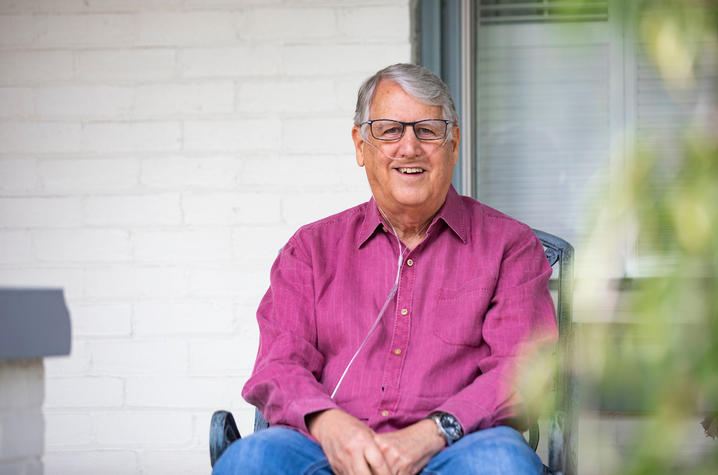 Tom Williams, a UKHC patient, enjoys a fall day on his front porch.