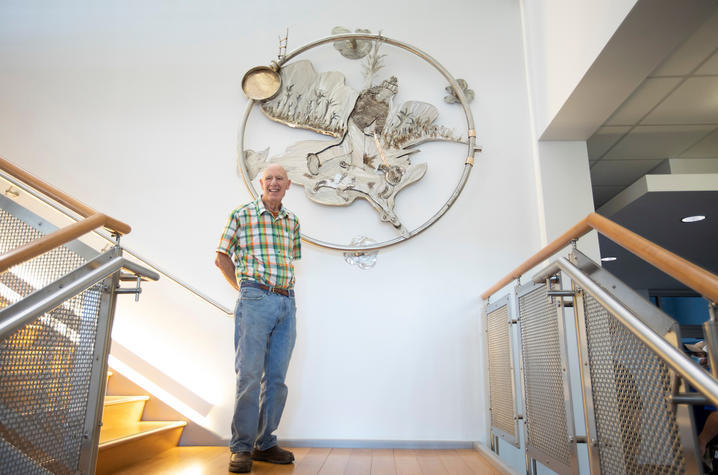 photo of donor Kirk Kopitzke with "Being Alive" sculpture by Garry Bibbs in the Lexington Senior Center