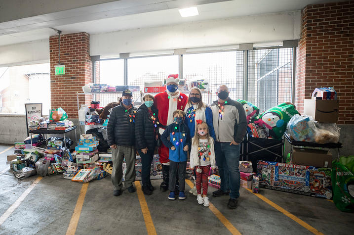 Photo of UK Chief of Police Joe Monroe with the Ard Family at the 2020 Cram the Cruiser toy drive