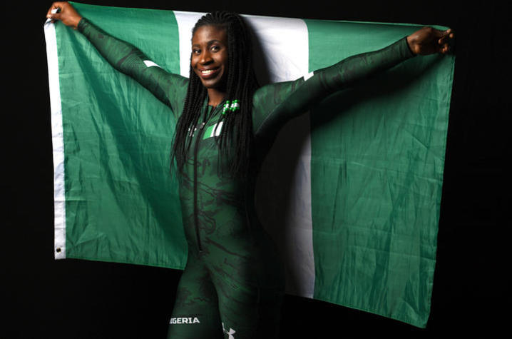 photo of Simi Adeagbo with Nigerian flag