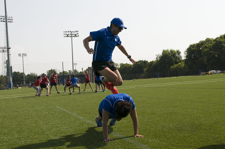 Vets and civilians participate in fitness exercises at the Johnson Center Fields
