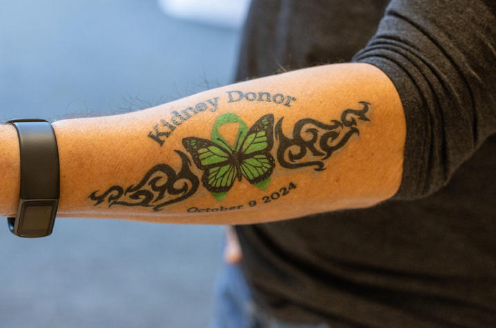 image of Tom's "kidney donor" tattoo on his forearm