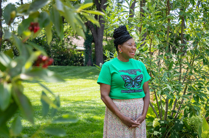 Image of Ashley Holt standing in garden