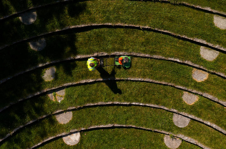 Aerial photo of two people mowing.