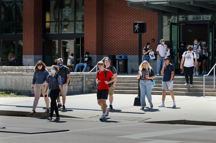 students walking across the cross walk in front of the student center toward memorial coliseum