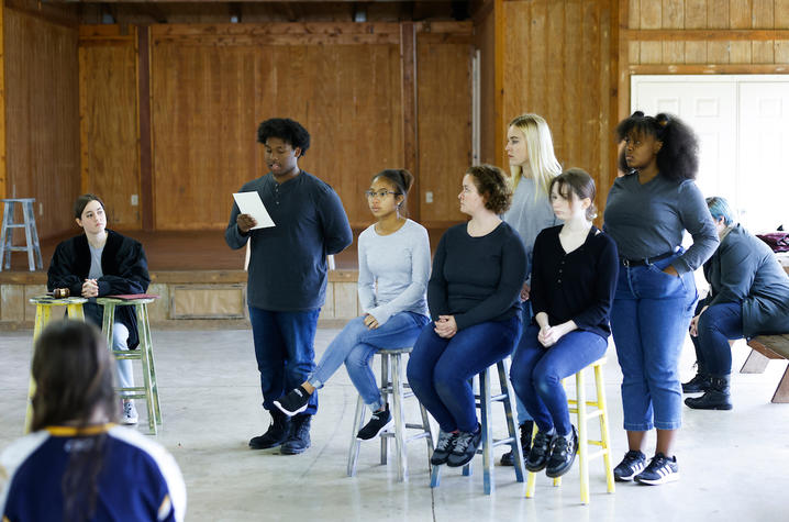photo of cast members in court with jury formation in UK Theatre's "The Laramie Project"