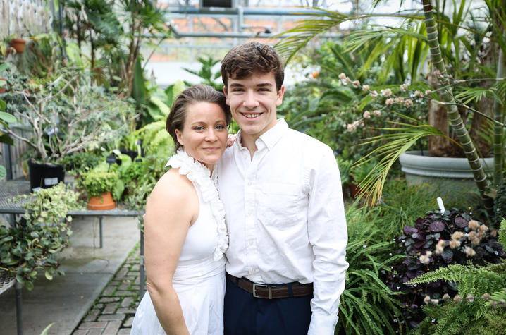 Anglea Sanchez (left) in white next to son Cyrus (right) in white