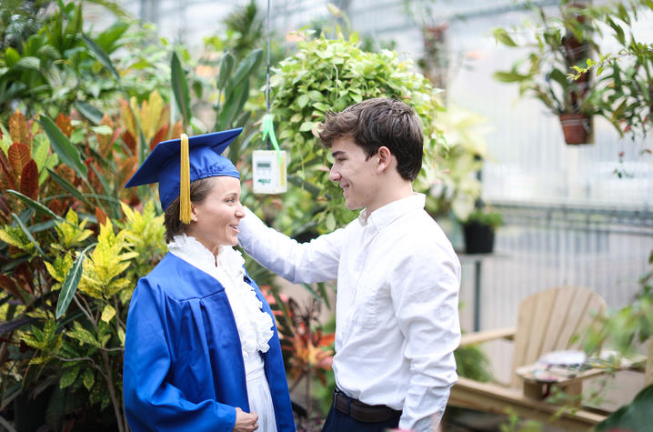Angela Sanchez in UK cap and gown inside greenhouse (left) and son Cyrus (right)