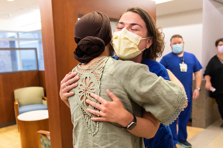 UK Markey Cancer Center patient hugs a nurse who helped her through hospital stays.