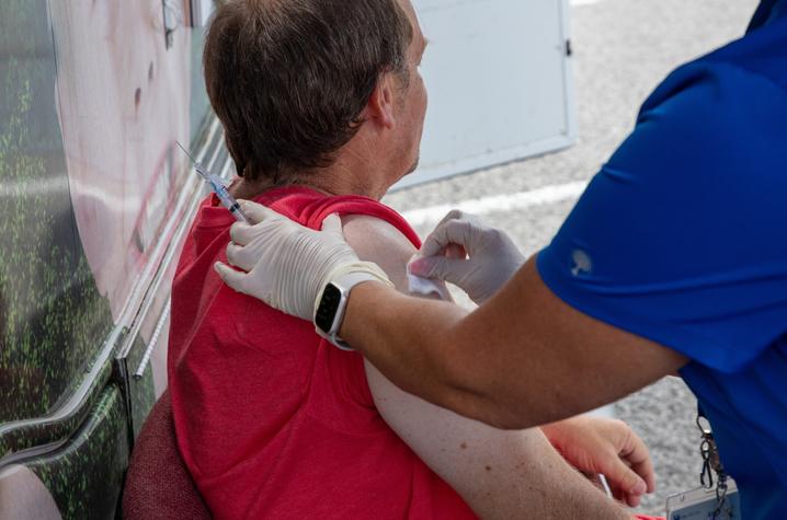 A flood survivor receives a tetanus vaccination at UK HealthCare's mobile care unit in Hazard, Ky. Photo by Hilary Brown