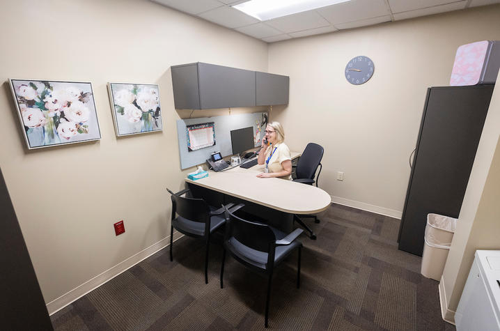 speech therapist talking on the phone at her desk