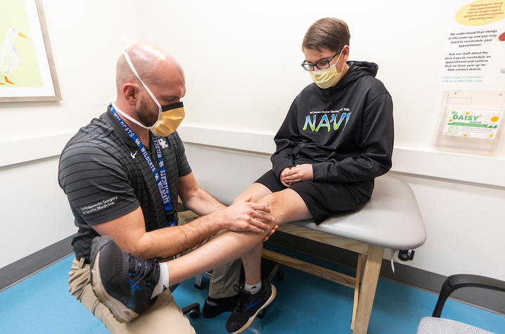 michael getting an orthopaedic exam from Dr. Wilson at Shriners