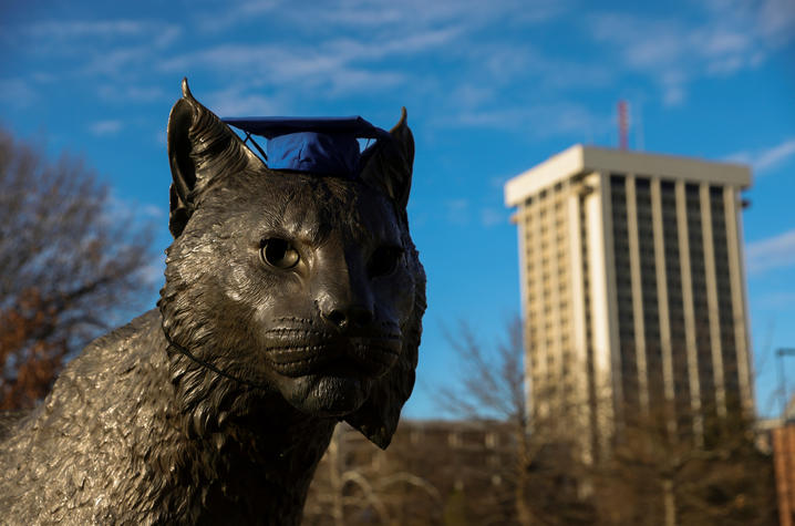 bowman statue with graduation cap