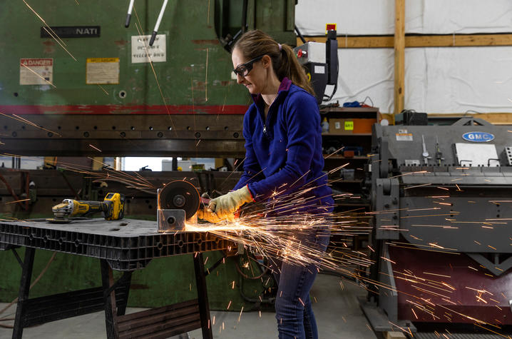 Jessica Moore often helps out in her family's welding shop by grinding metal. This is what she was doing when she first started experiencing symptoms of a stroke.  Arden Barnes | UKphoto