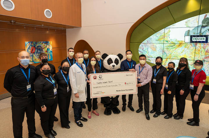 Photo of check presentation with Panda Express staff members and KCH leadership