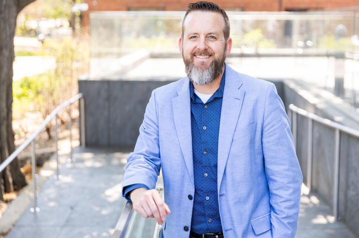 Lou Hirsch, Ph.D., assistant professor, standing outside 