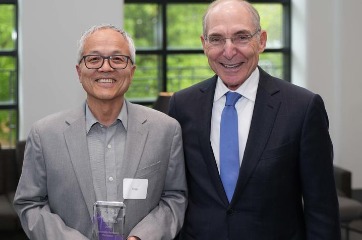 Feng Li, DVM, Ph.D., pictured with UK President Eli Capilouto