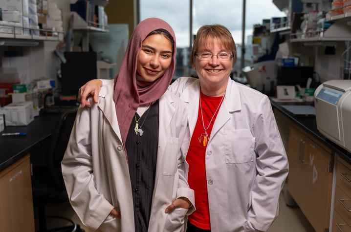 Elaf Ghoneim and Linda Van Eldik pose together in the lab for a photo